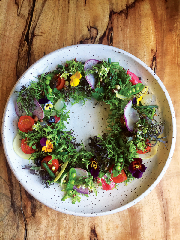 Edible lei of flowers and salad